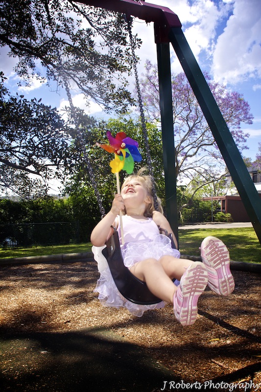 Little girl on swing - portrait photography